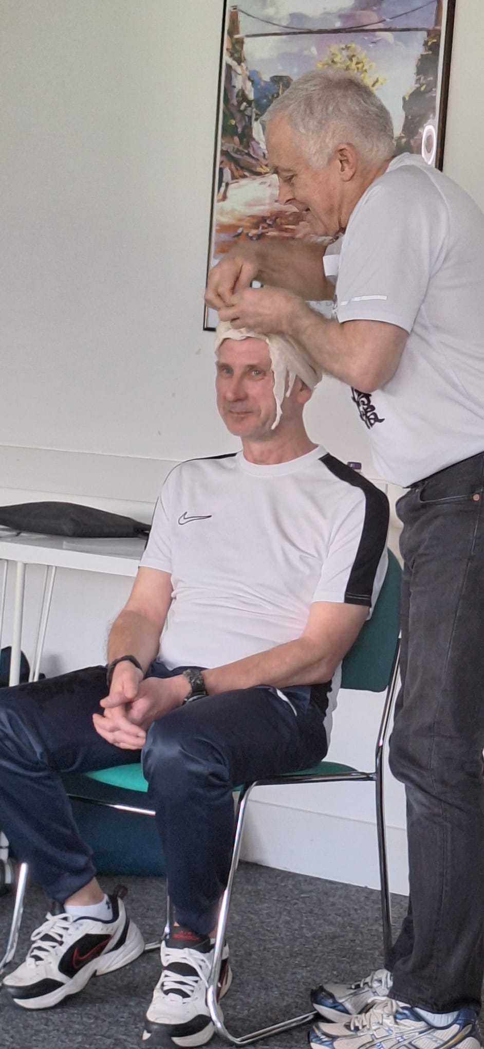 First Aid - Nick applies bandage to Steve Sensei